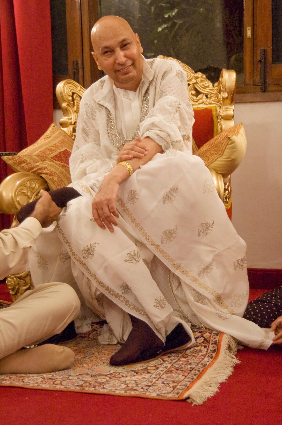 Guruji seated during a community gathering